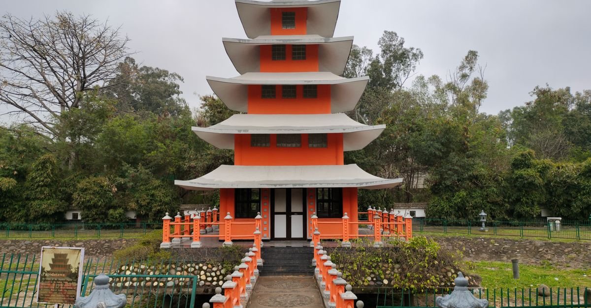 Capture of a vibrant pagoda in the gardens of Chandigarh, India, showcasing cultural architecture.