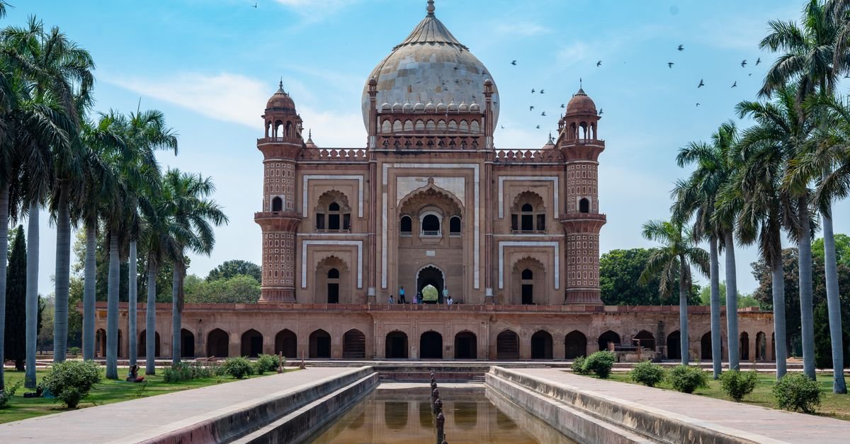 Beautiful view of Safdarjung's Tomb and garden, showcasing Mughal architecture under a clear blue sky.