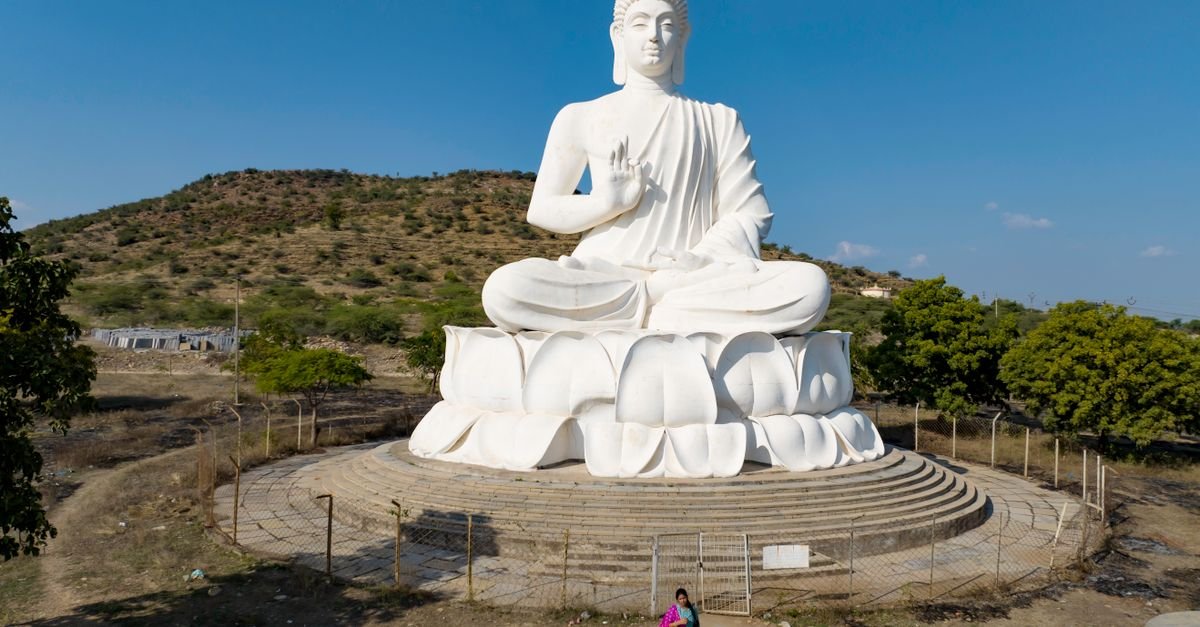 A stunning aerial view of a large white Buddha statue in Andhra Pradesh, India.